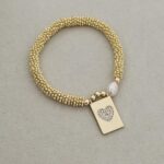 .Elastic bracelet with gold plated and pearl