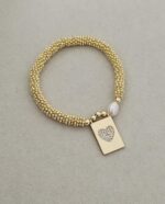 .Elastic bracelet with gold plated and pearl