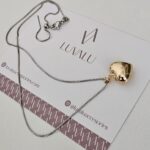 Silver chain and golden heart.