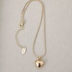 ..Military style chain and golden heart, gold plated.