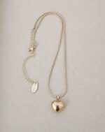 ..Military style chain and golden heart, gold plated.