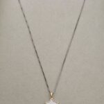 Silver chain and golden star, silver and gold plated.