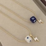 Military style chain, evil eye.