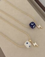 Military style chain, evil eye.