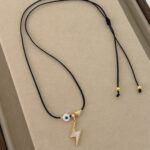 Lightning and evil eye, black cord.