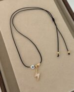 Lightning and evil eye, black cord.