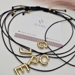 Black Cord, Initials