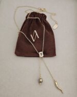 ...Lariat-style necklace